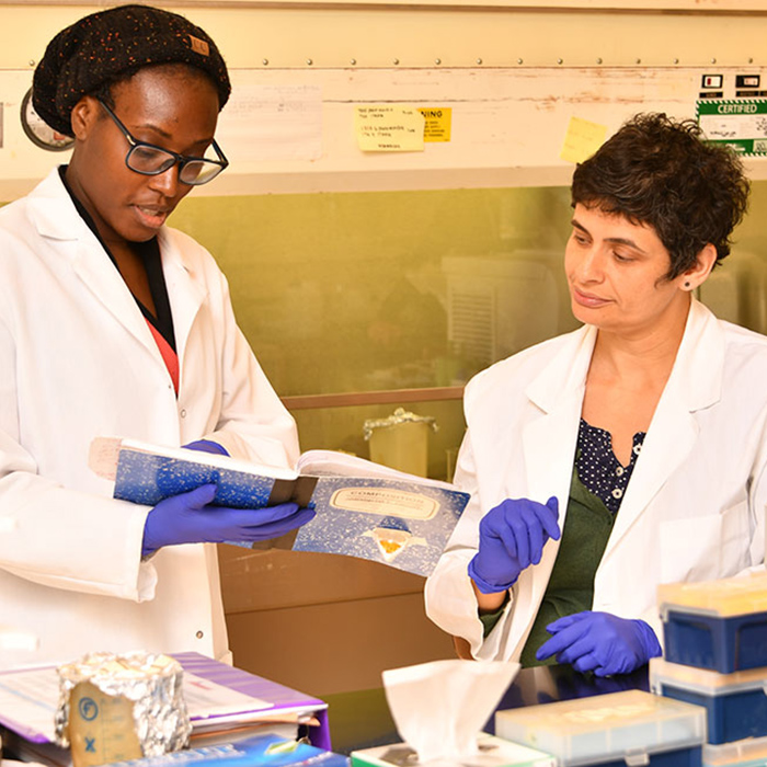 teacher and student in a science lab