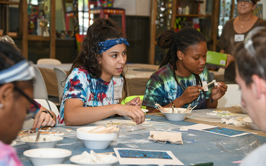 Students work on a mosaic with a local community organization.