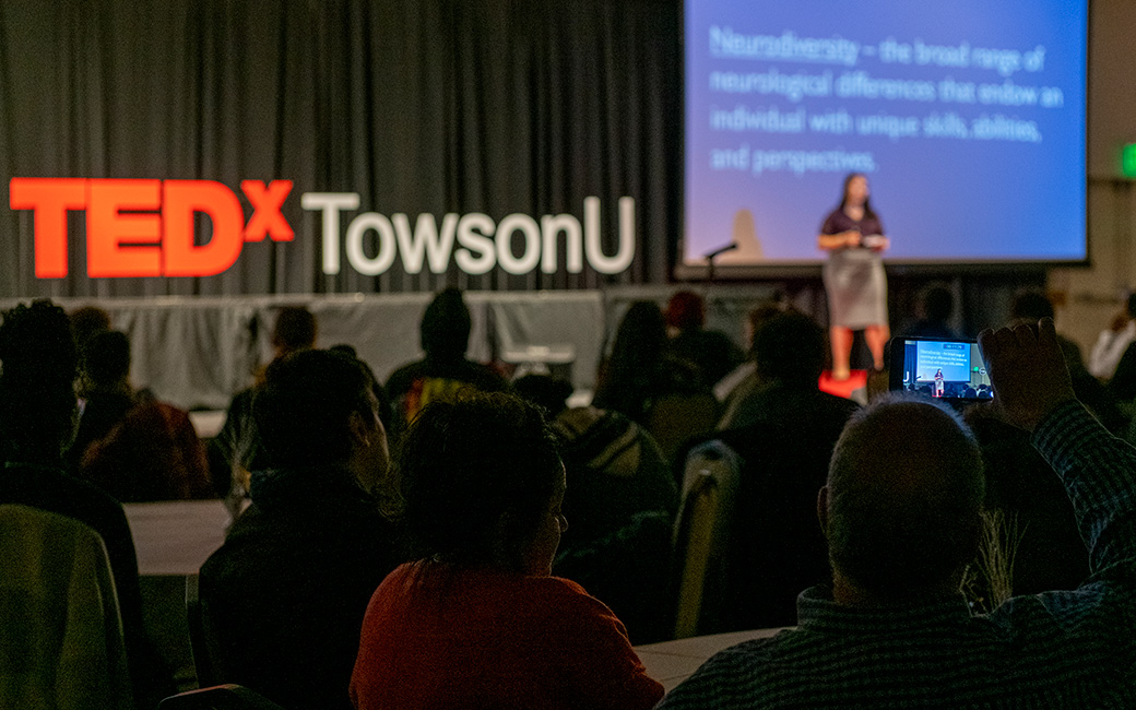 The TEDxTowsonU audience watches a talk.   