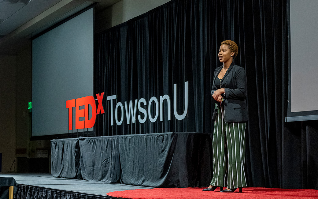 A presenter speaks at TEDxTowsonU. 