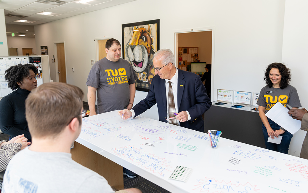 President Ginsberg participates in a voter engagement activity.
