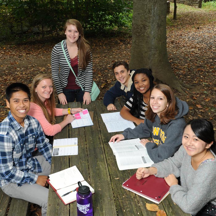 Students gathered around table in Glen Woods