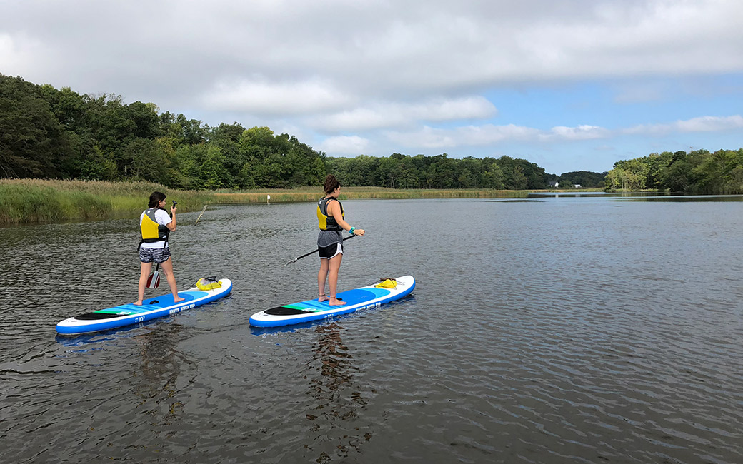 Students participating in Stand Up Paddleboarding