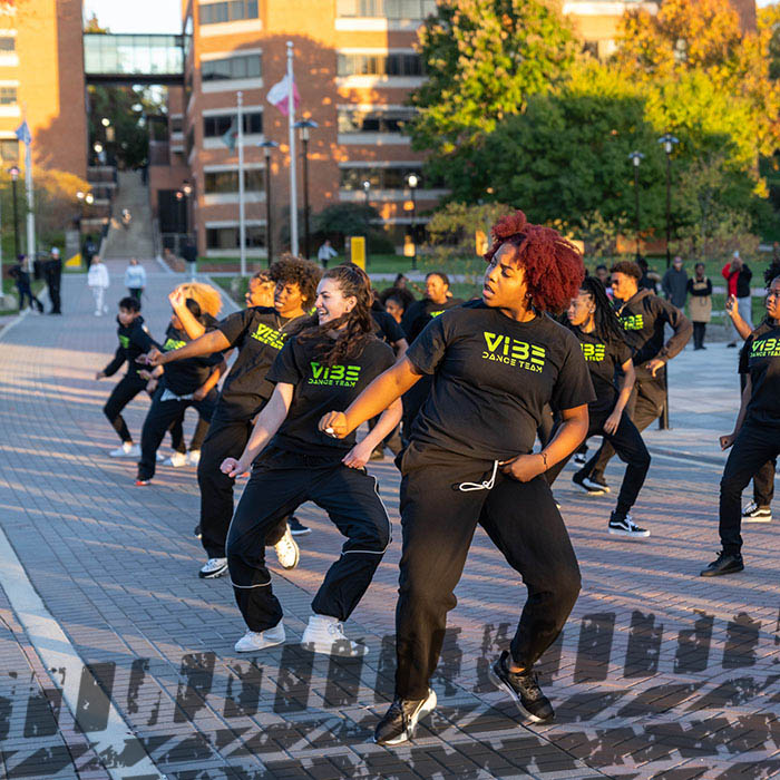 TU students dancing outside on campus