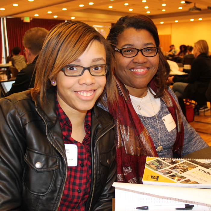 two students smiling