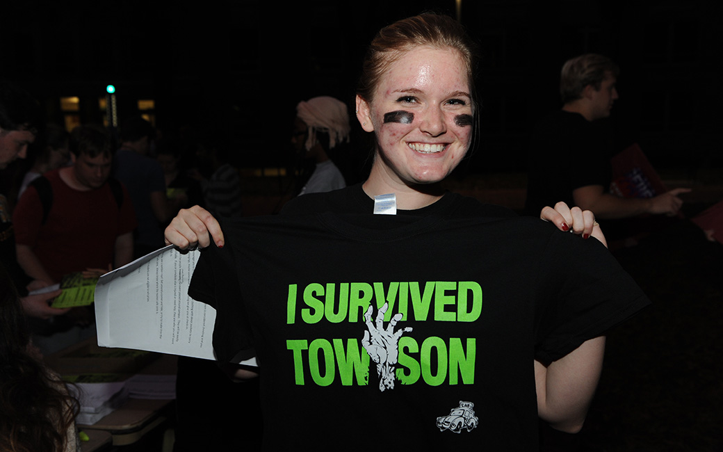 TU student holding up a t-shirt