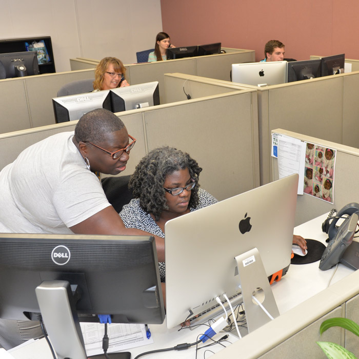 help center staff answering phones and working on computers