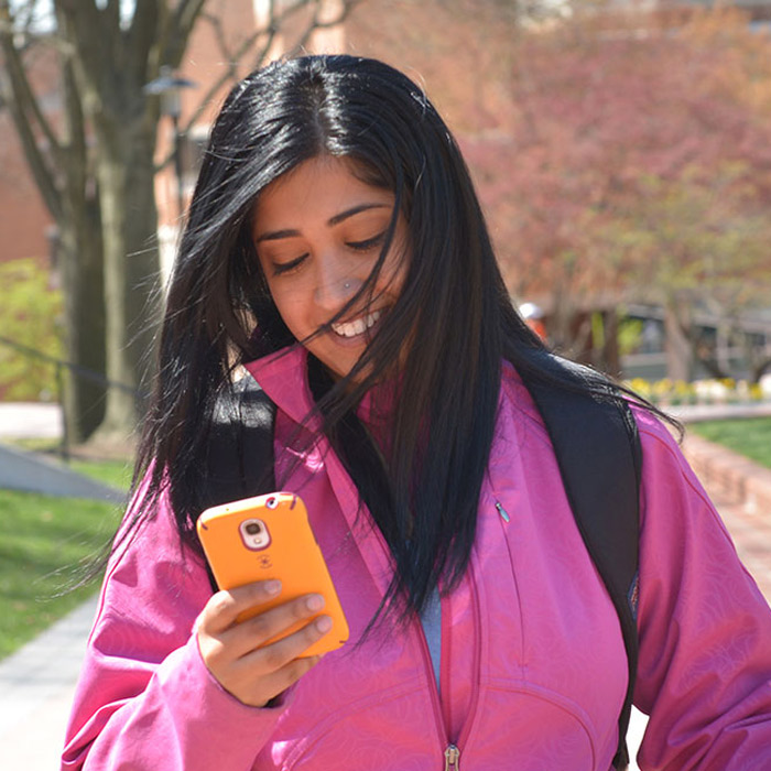 student looking at phone